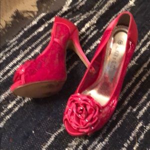 Pink lace high heeled shoes